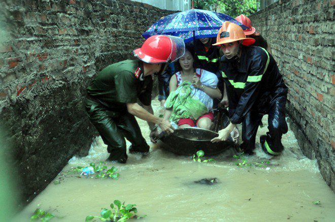 Why does Quang Ninh experience flooding despite being coastal?