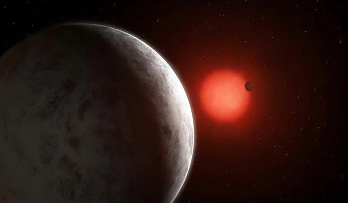 Illustration of two super-Earths orbiting a red dwarf star.