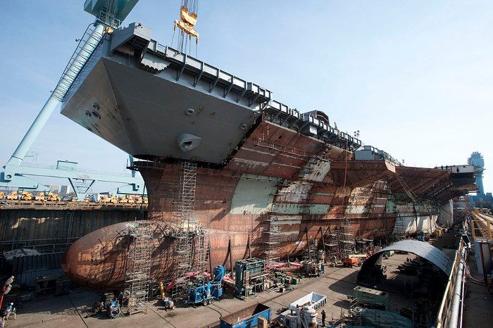 The crane at Newport News Shipbuilding is assembling the upper bow section, which weighs 787 tons.