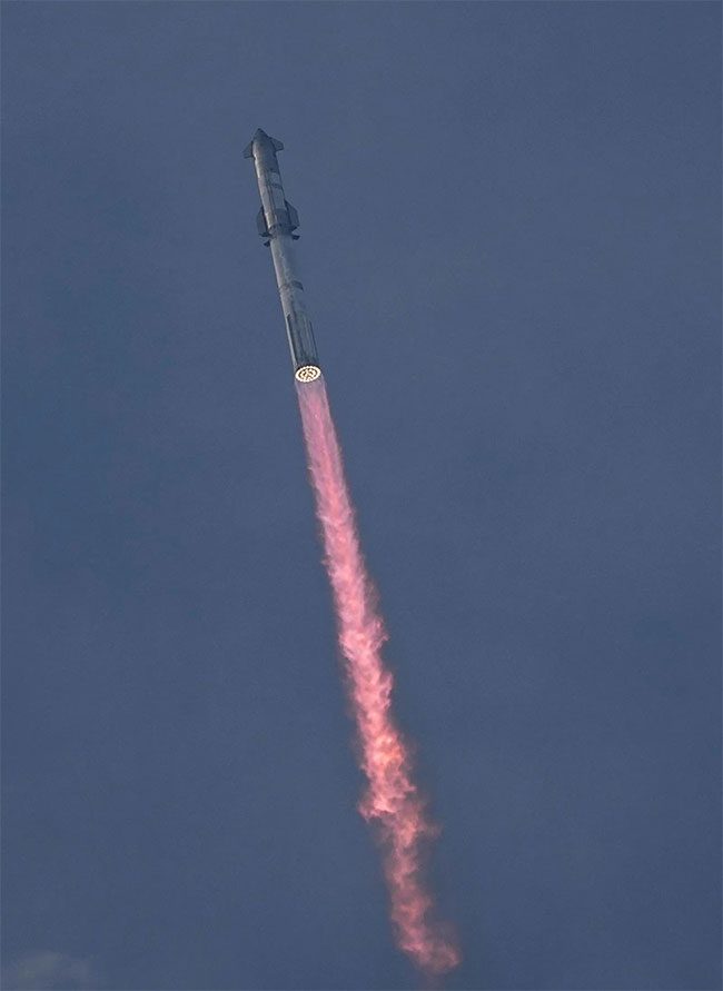 Super Heavy rocket carrying SpaceX's unmanned Starship spacecraft lifts off