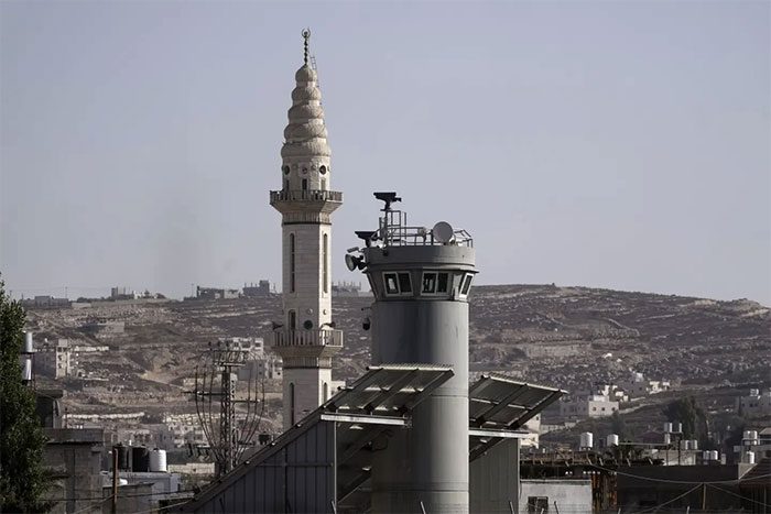 Nearby the watchtower is the minaret of a major synagogue in the area.