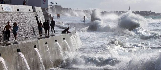 Visitors walking on the wave protection dike.