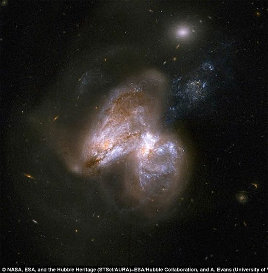 Observing the collision of two galaxies creating black holes