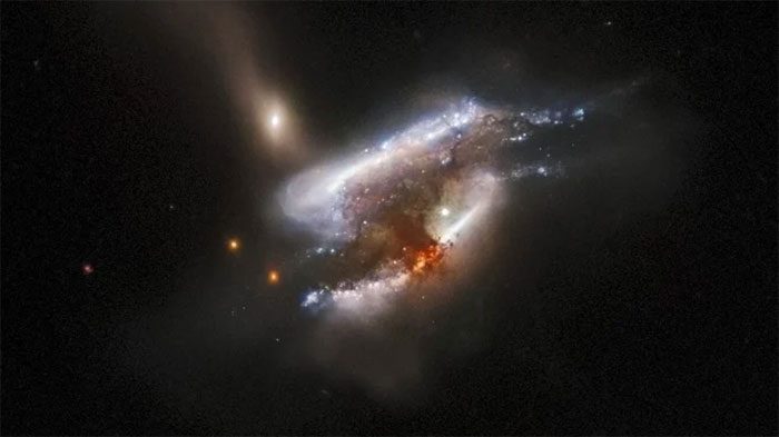 Supermassive black holes on a collision path as three galaxies collide