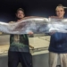 two men catch giant catfish 137002