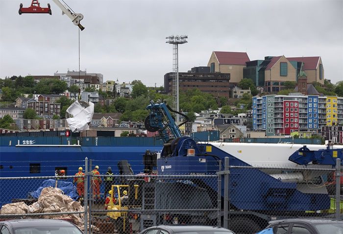 Debris from the Titan submersible being brought up in St. John's on June 28.