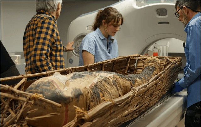 Scientists preparing to scan the mummy.