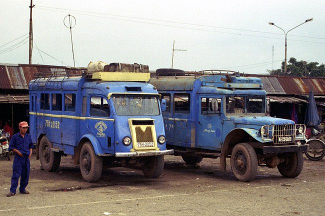 A Renault Goélette bus (left) at a bus station in Hue in 1996.