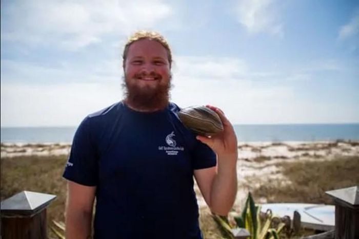 Parker and the clam he caught.