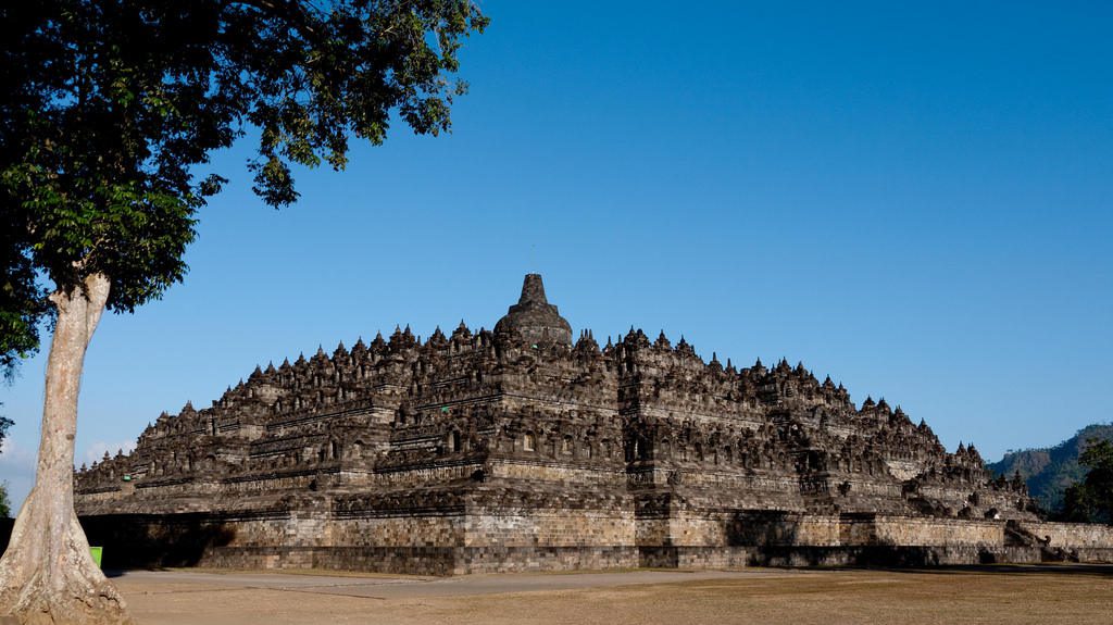 Located in Central Java, Indonesia, Borobudur is a massive Buddhist temple that rises suddenly amidst a valley surrounded by dense forest.