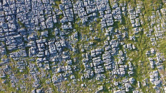 Limestone Pavement is formed by glacial activity on limestone bedrock.