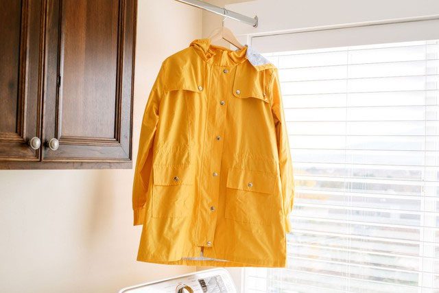Spreading the raincoat out or hanging it on large hooks helps it dry faster.