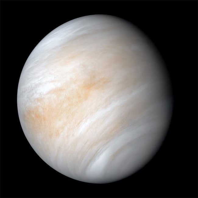 The surface of Venus is covered by a thick layer of clouds.