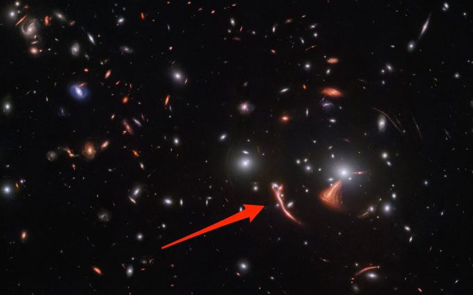 Galaxy cluster SDSS J1226+2149 distorted by gravitational lensing