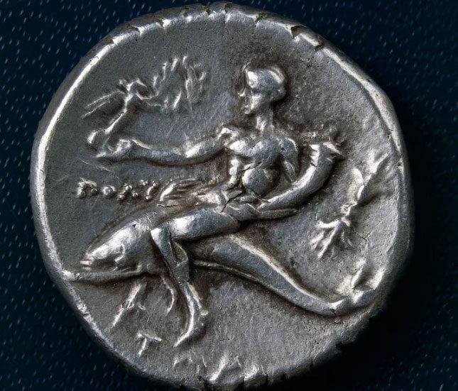 A silver coin depicting the symbol of Taranto.