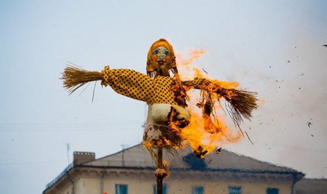 Burning effigies to ward off bad luck.