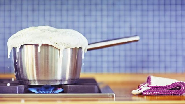 Bubbles formed on the surface of milk due to steam being trapped by the layer of fat and protein.