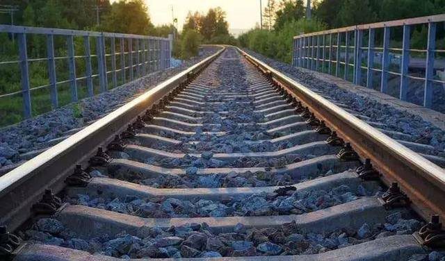 The layer of ballast under the tracks plays a crucial role.