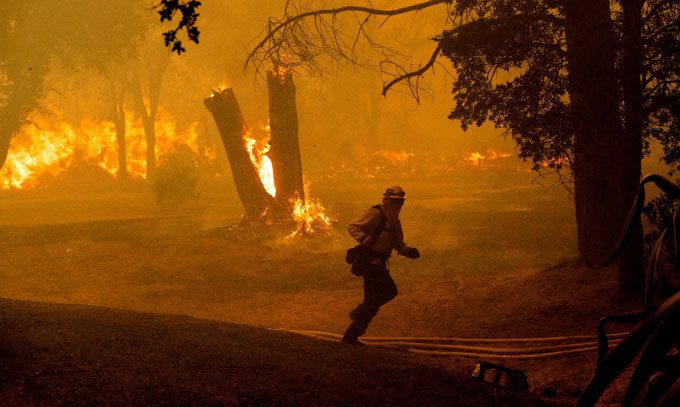 Firefighters battling a blaze in Oroville, California, USA.