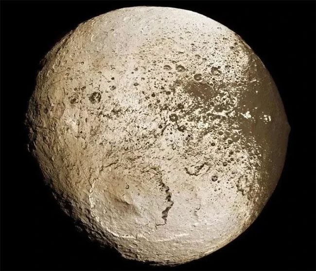 Whenever Iapetus moved to a specific area, its brightness would significantly decrease.