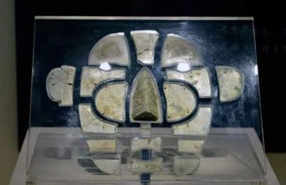 Jade burial covering the face.