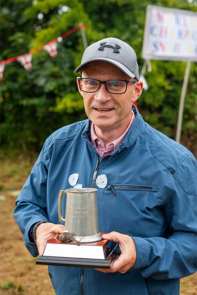 A man with the winning snail in the race