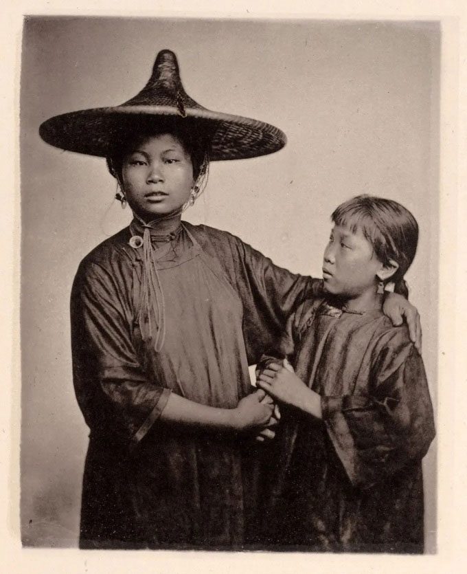 Two girls from a family living on the water