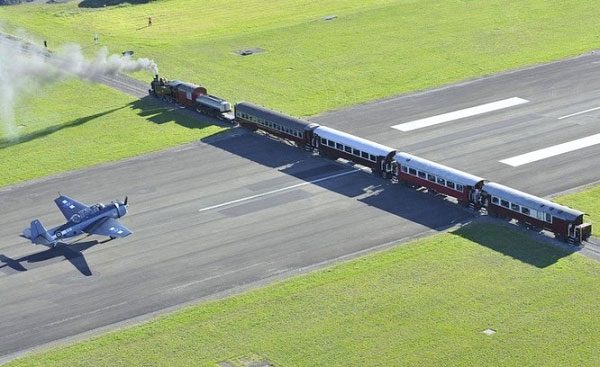 An unbelievable moment at a railway crossing with a runway in New Zealand.