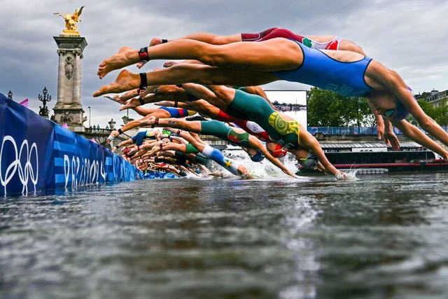 Athlete swimming in the Seine River