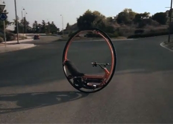 one wheeled motorcycle balancing on road 135504