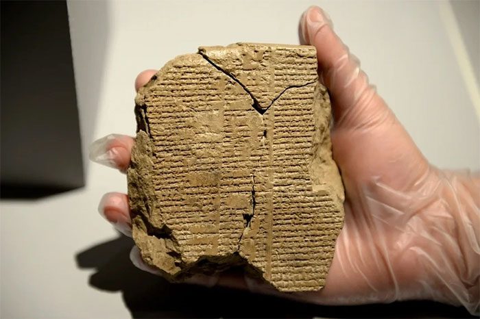 A fragment of the Epic of Gilgamesh on a clay tablet.