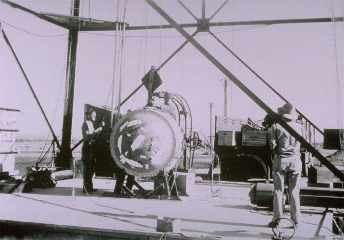 Researchers beside the "Gadget" metal sphere