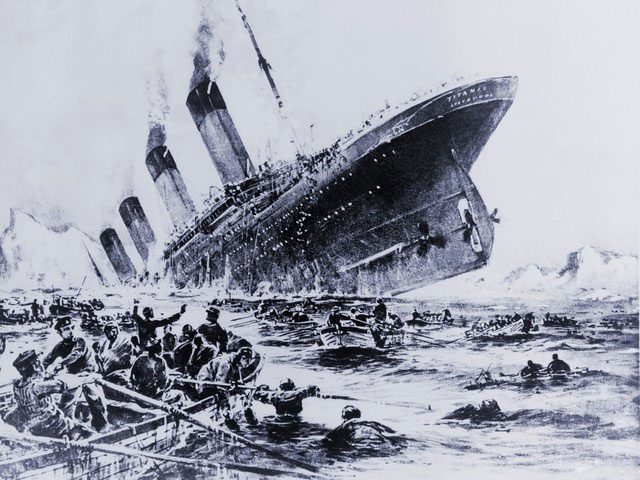 Lifeboats evacuating passengers from the sinking Titanic.