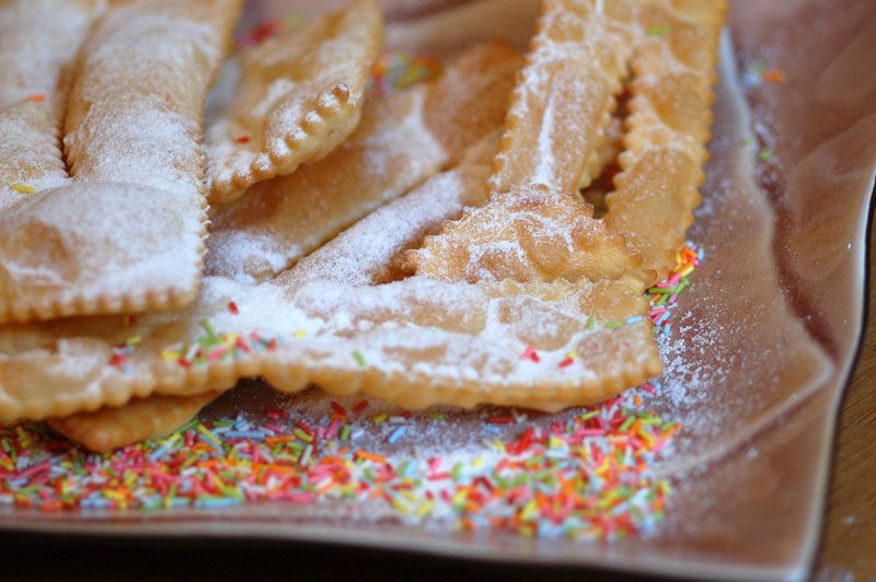 Cakes and other baked goods are commonly featured on the menus of many countries during Christmas and New Year, especially those shaped like circles or rings. Italy has the chiacchiere made from fried dough dusted with sugar.