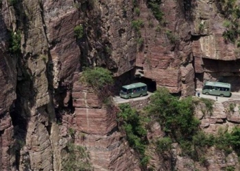 the unique village on high where people move by hand 1 2km tunnel through the mountain to get down to the stream 115258