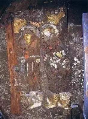 Two bodies wearing golden masks found in the tomb.