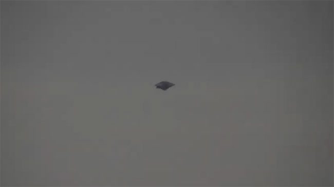 A triangular flying object hovering over the sky of Curitiba.