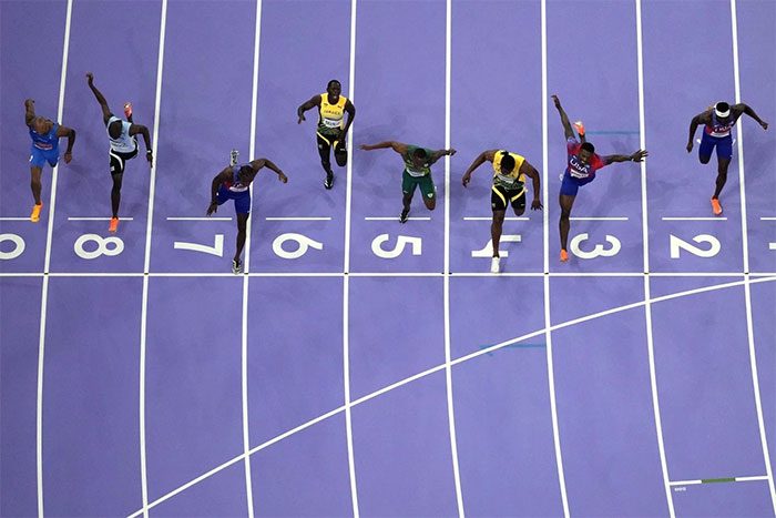 The moment athletes cross the finish line in the men's 100m Olympic event at Paris 2024.