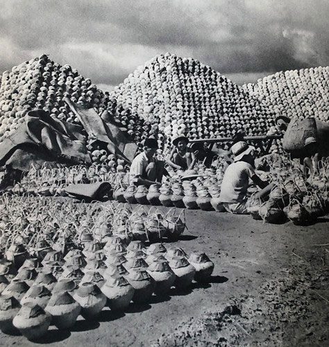 Jars used for storing fish sauce piled high in a province of Southern Vietnam.