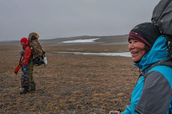 Aka Simonsen preparing to leave camp with Brian Buma as the weather begins to change.