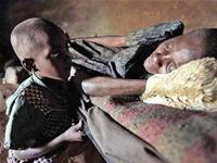A boy caring for his mother with AIDS in Kenya