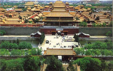 A panoramic view of the Forbidden City illustrating a vast area and numerous distinct structures with golden roofs and red walls.