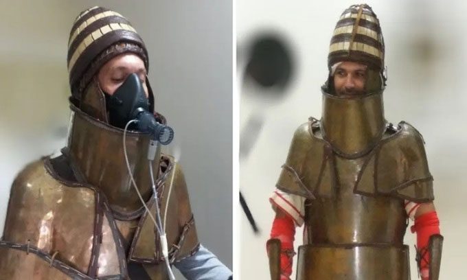 Volunteers wearing a replica of Dendra armor.