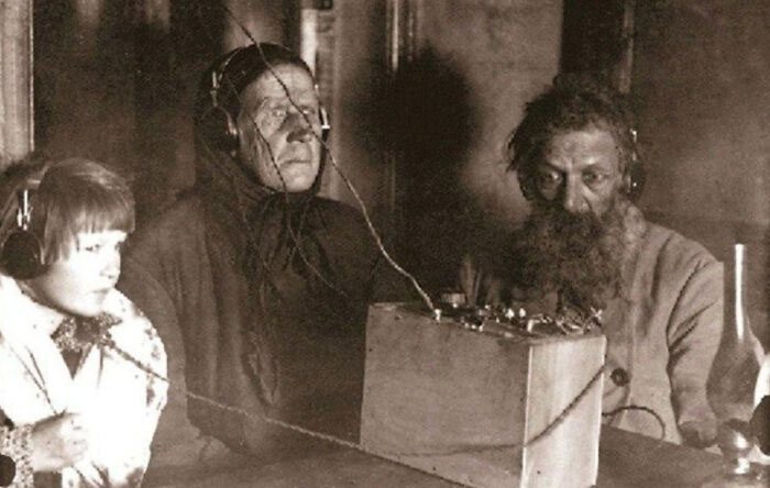 A Soviet farmer listening to the radio for the first time in 1928.