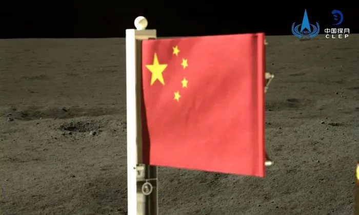 The Chang'e-6 probe plants the Chinese flag on the Moon's far side.