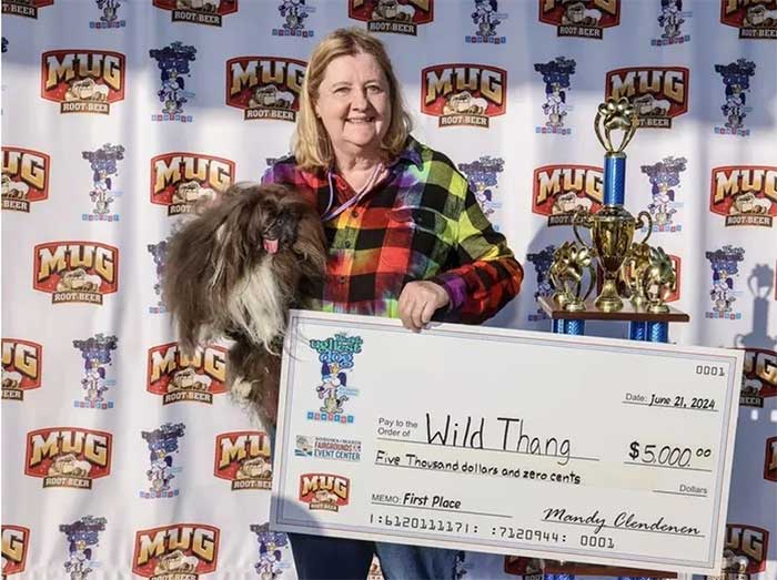 Wild Thang and owner receiving the $5,000 prize after winning the contest