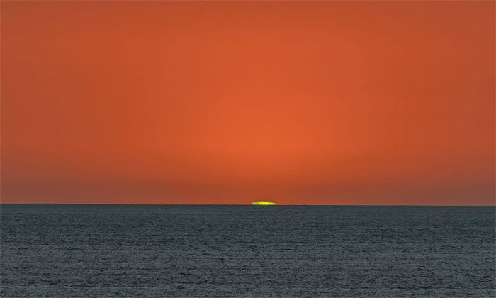 The green flash can occur when the Sun sets over the sea.