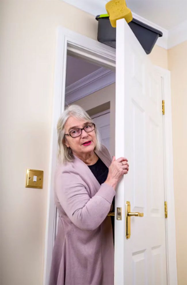 Positioning a bowl of water steadily on a door,