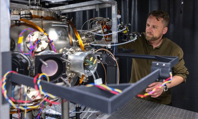 Dr. Joseph Cotter with the quantum accelerometer used for navigation.