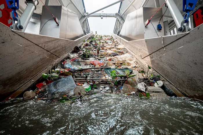 A river waste filtering system in operation.